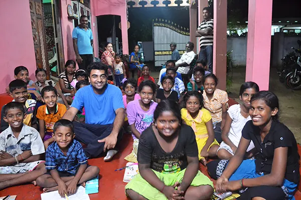 Children in class with a Blue Magpie Foundation volunteer in Sri Lanka