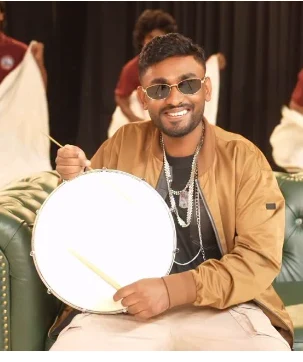 Kiran Suthaharan playing the drum
